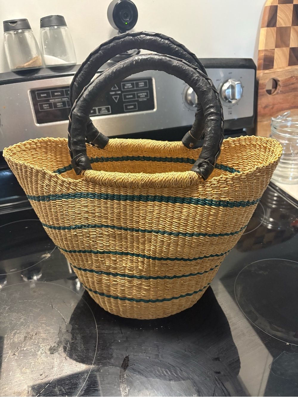Handwoven Straw Tote Bag with Black Wrapped Handles and Green Stripe
